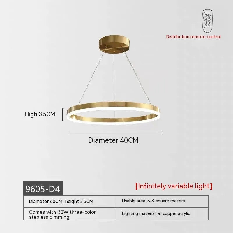 Modern copper circle chandelier with acrylic elements in a Nordic light luxury style for a living room.