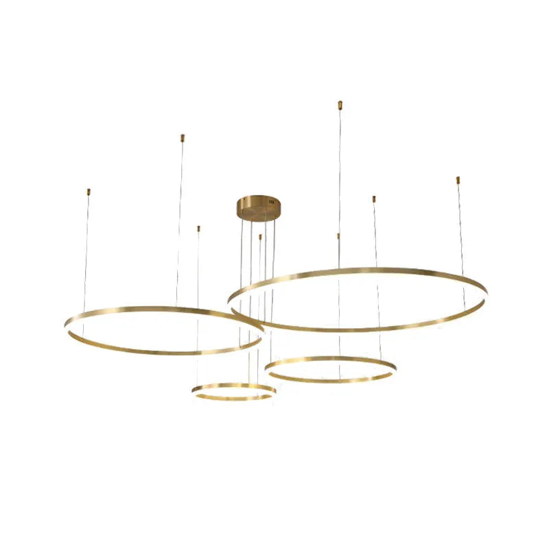 Modern copper circle chandelier with acrylic elements in a Nordic light luxury style for a living room.
