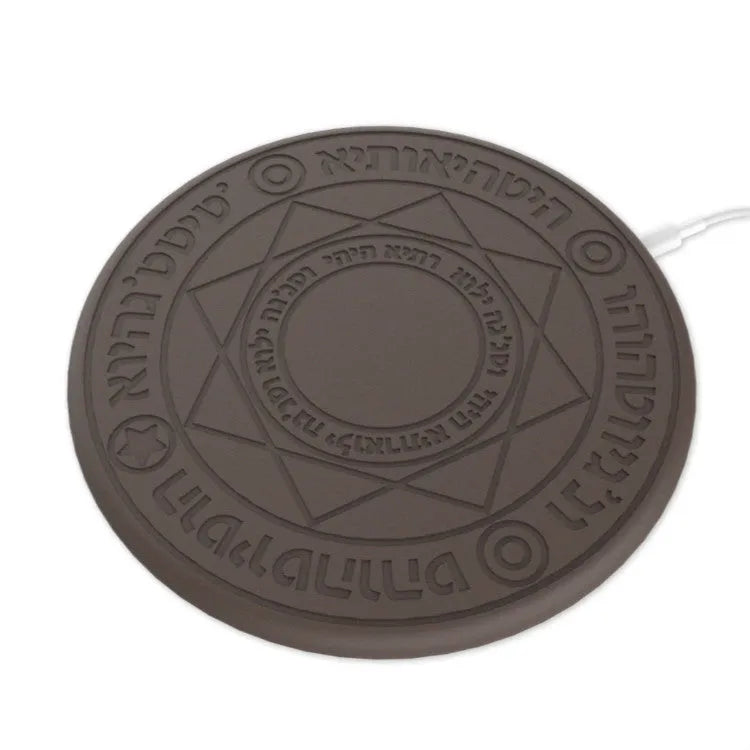 Square 25cm 10W fast wireless phone charger with glowing magic array pattern in black on a desk