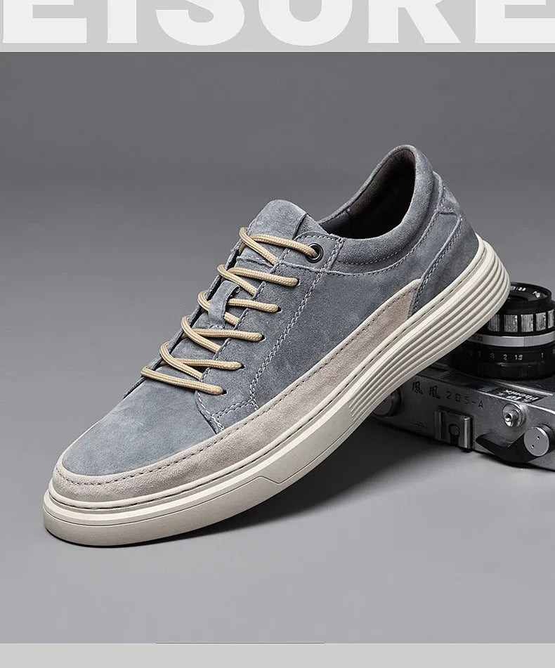 Men's grey pigskin leather low-top casual skate shoes with a round toe and rubber sole on a white background.