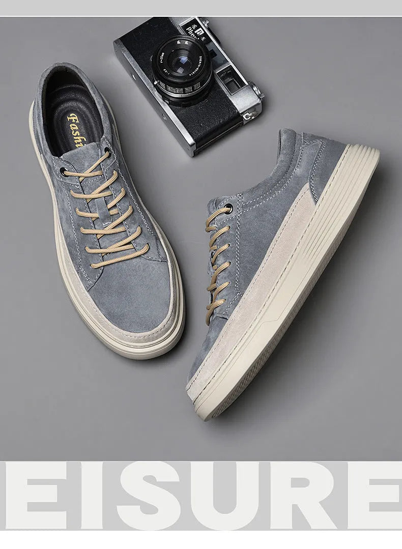 Men's grey pigskin leather low-top casual skate shoes with a round toe and rubber sole on a white background.