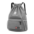 Oxford fabric drawstring travel backpack in grey, shown with double shoulder straps and bucket shape.