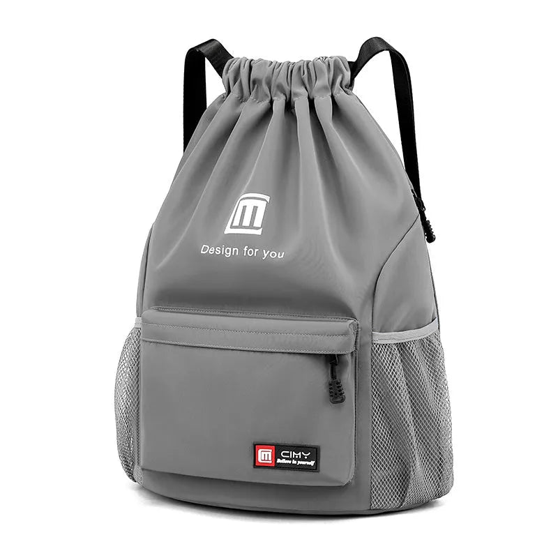 Oxford fabric drawstring travel backpack in grey, shown with double shoulder straps and bucket shape.