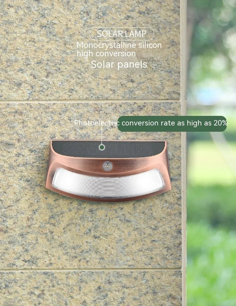 Solar outdoor wall lamp with smiling face design measuring 153mm wide