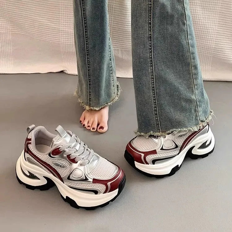 Women's red and silver mesh platform sneakers with a chunky rubber sole and lace-up front.