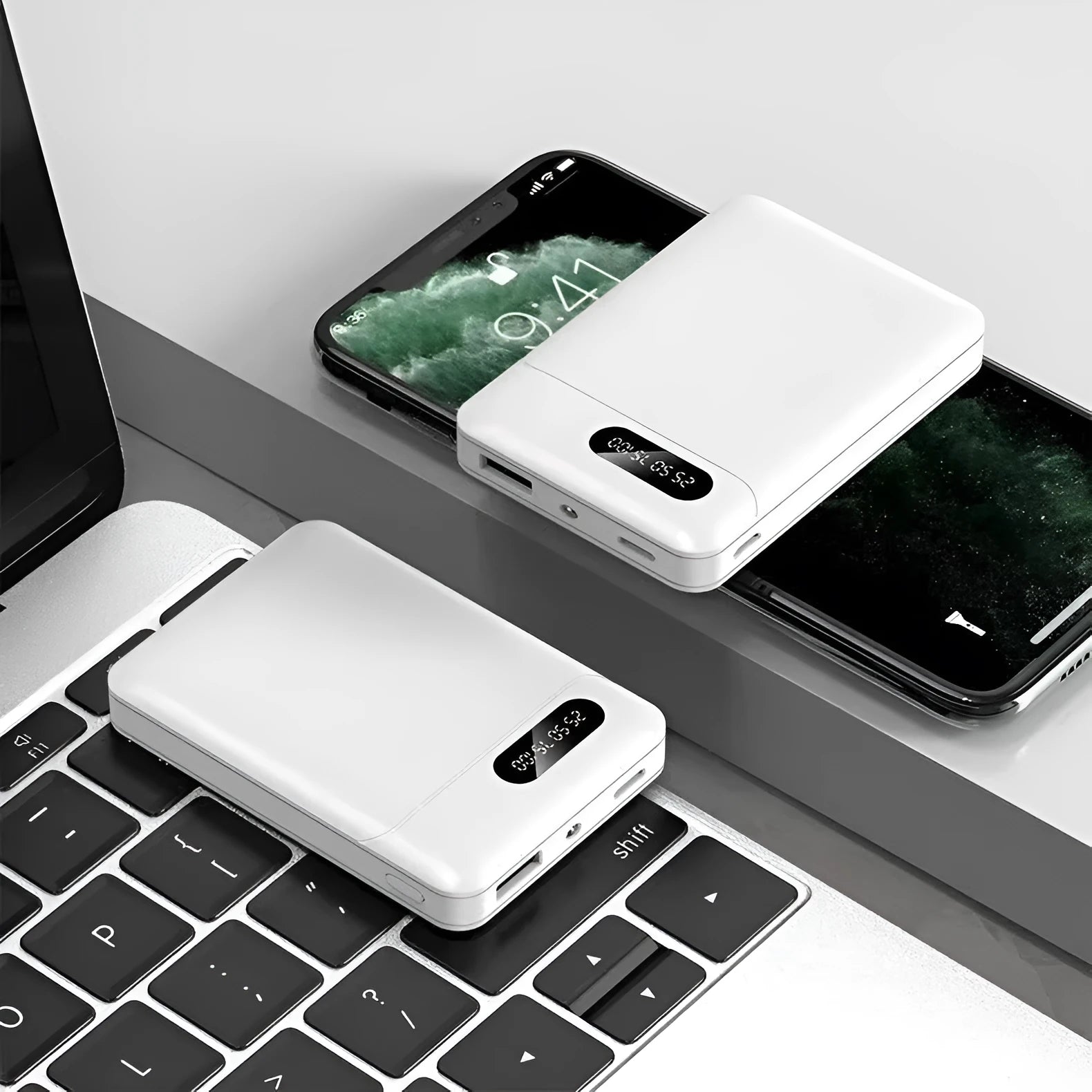 Black and white portable power bank with multiple USB ports showing front and side views.