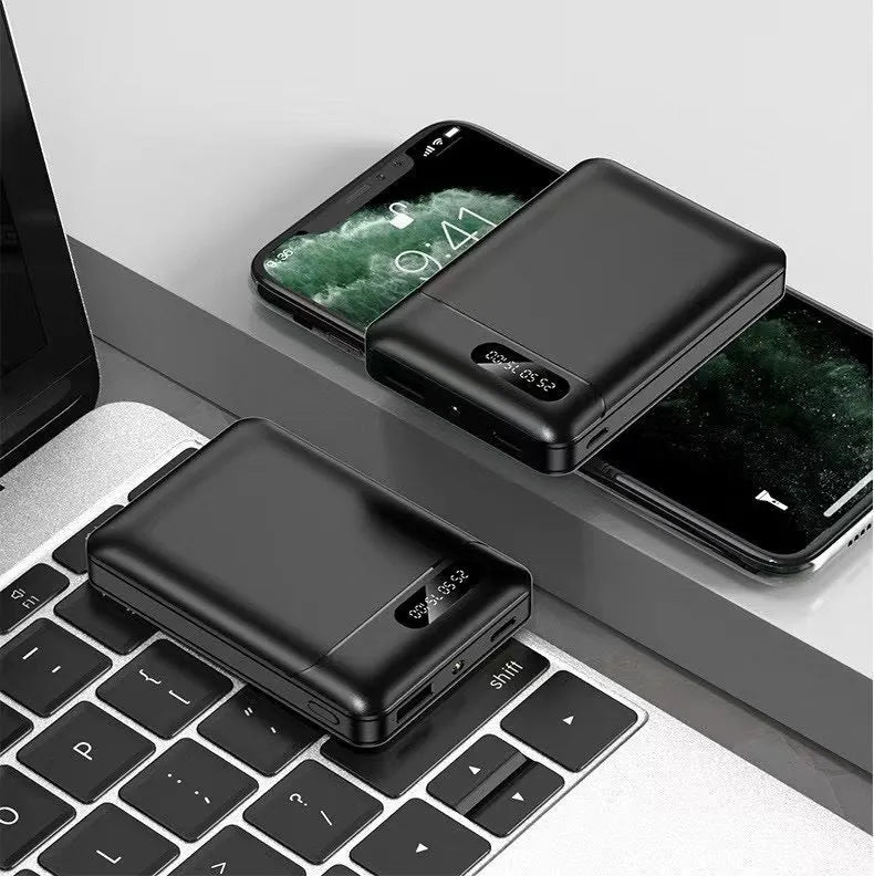 Black and white portable power bank with multiple USB ports showing front and side views.