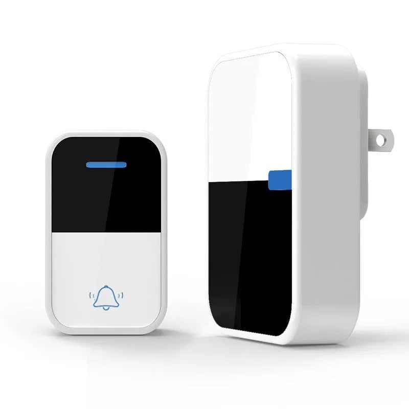 Modern white wireless doorbell receiver and self-generating transmitter on a table.