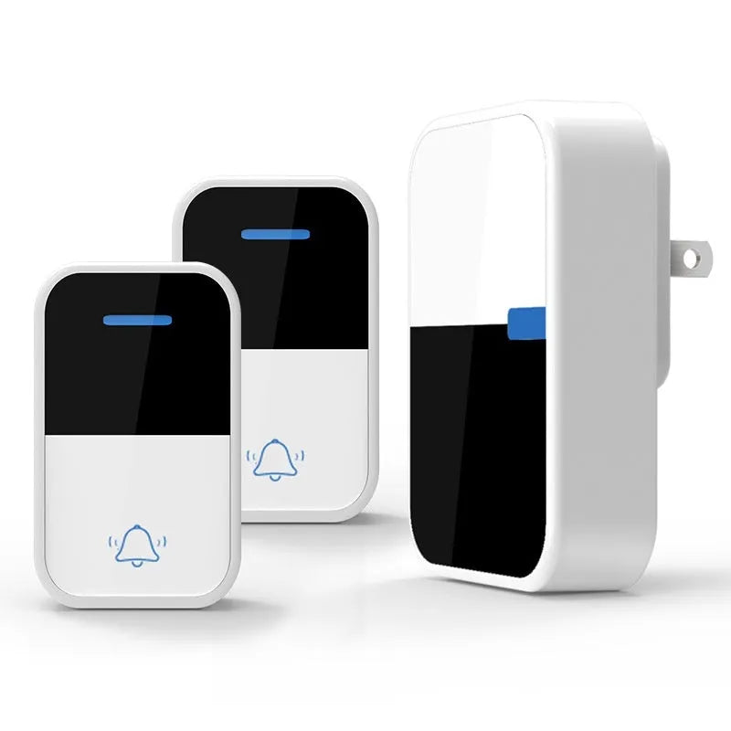 Modern white wireless doorbell receiver and self-generating transmitter on a table.