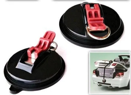 Black plastic and metal suction cup anchor measuring 11.8x5 cm with metal S-hooks on a car window
