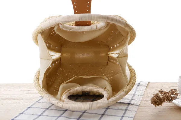Rattan handbag in round woven straw style with hard shell and inner pocket