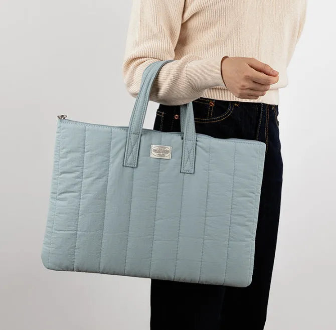 Personalised polyester laptop briefcase for 11 to 15.6 inch computers in black, white, green, and blue.