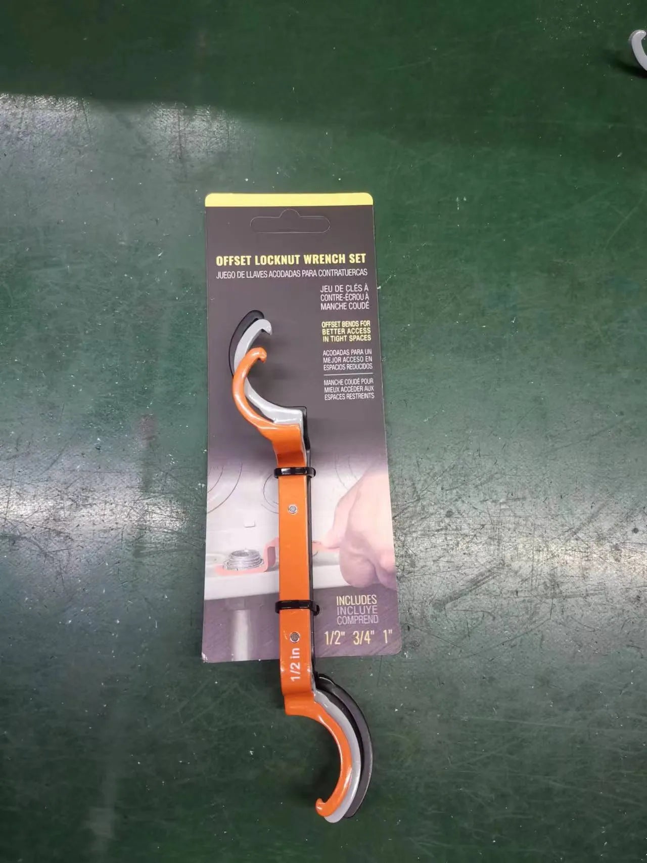 Crescent magnetic suction and catheter locking wrench three-piece set in orange, grey, and black.