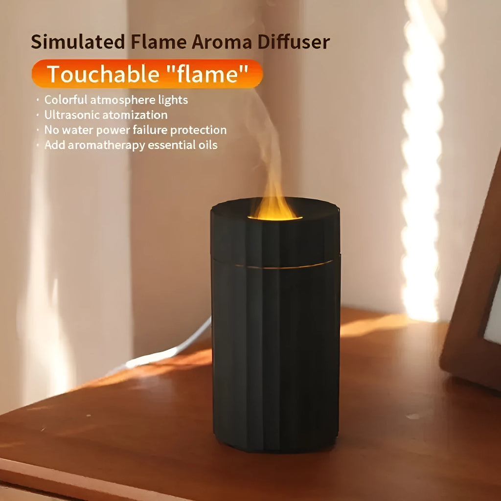 Black and white essential oil diffuser and humidifier with a simulated LED flame effect on a table.