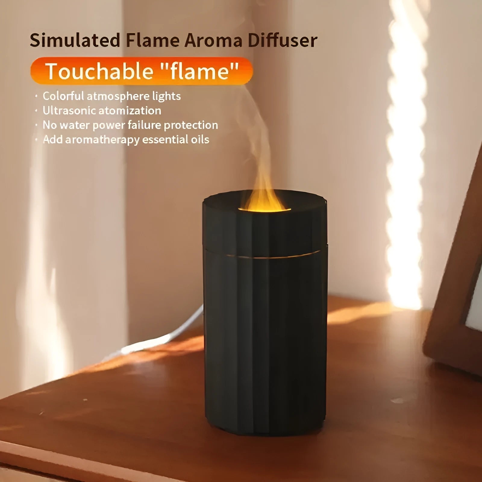 Black and white essential oil diffuser and humidifier with a simulated LED flame effect on a table.