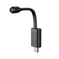 Black V380 wireless USB security camera showing compact size and microSD card slot.