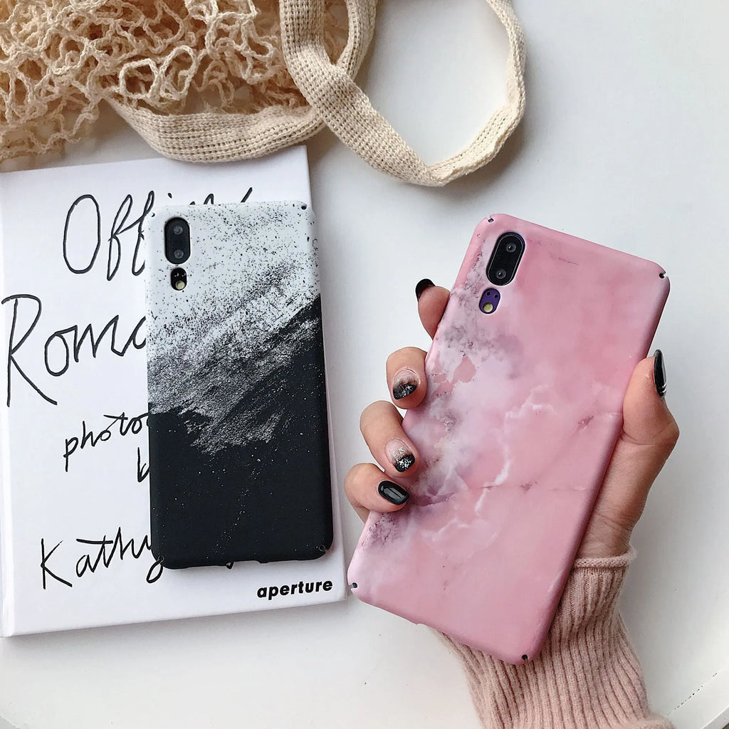 Black painted hard back phone case for Huawei models on a white background.