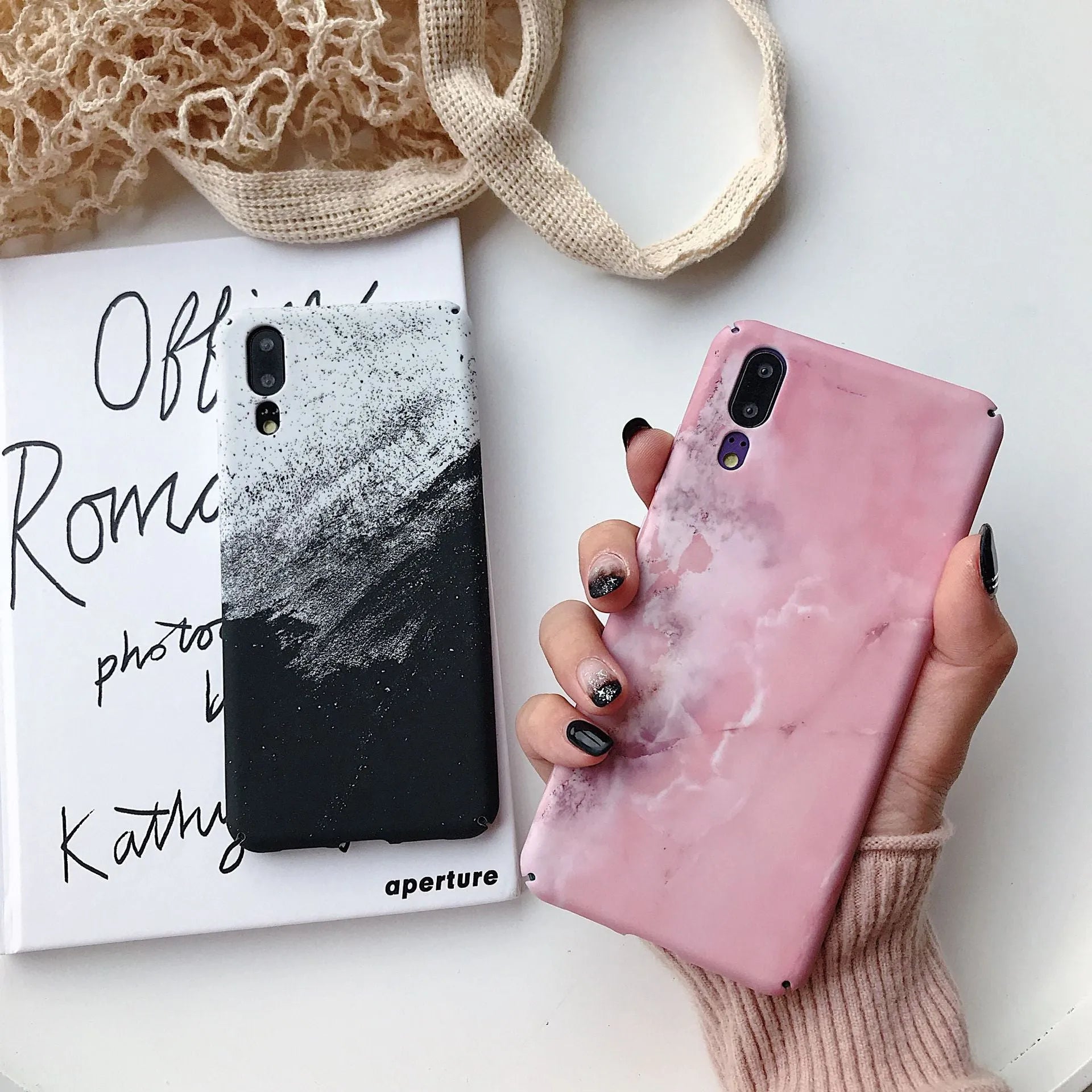 Black painted hard back phone case for Huawei models on a white background.