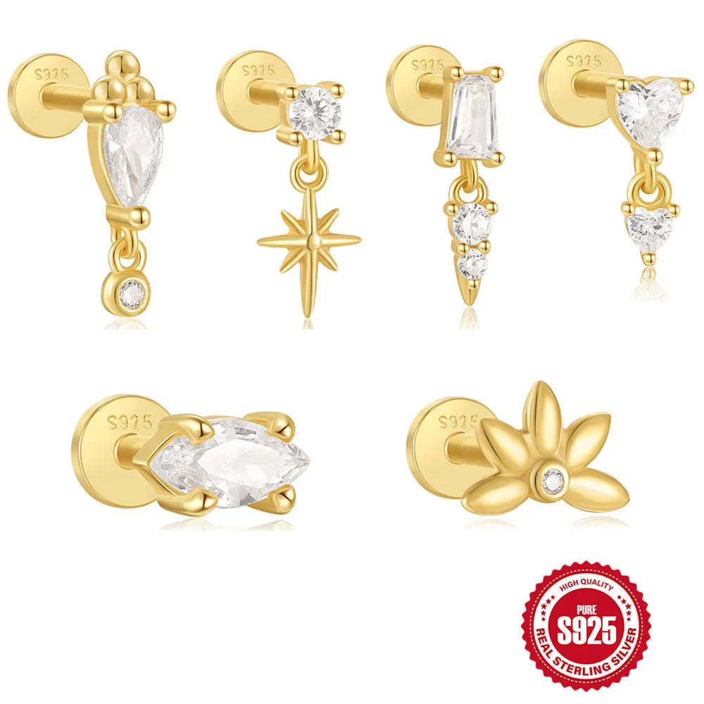 A gold tone sterling silver ear stud featuring a dangling tassel and XINGX inlaid design on the stud.