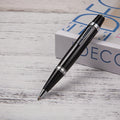 Short black metal ballpoint pen with rotating mechanism, showing bullet tip and compact dimensions
