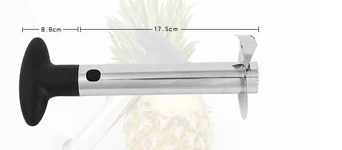 Stainless steel pineapple corer slicer with coloured plastic handle on a kitchen worktop.