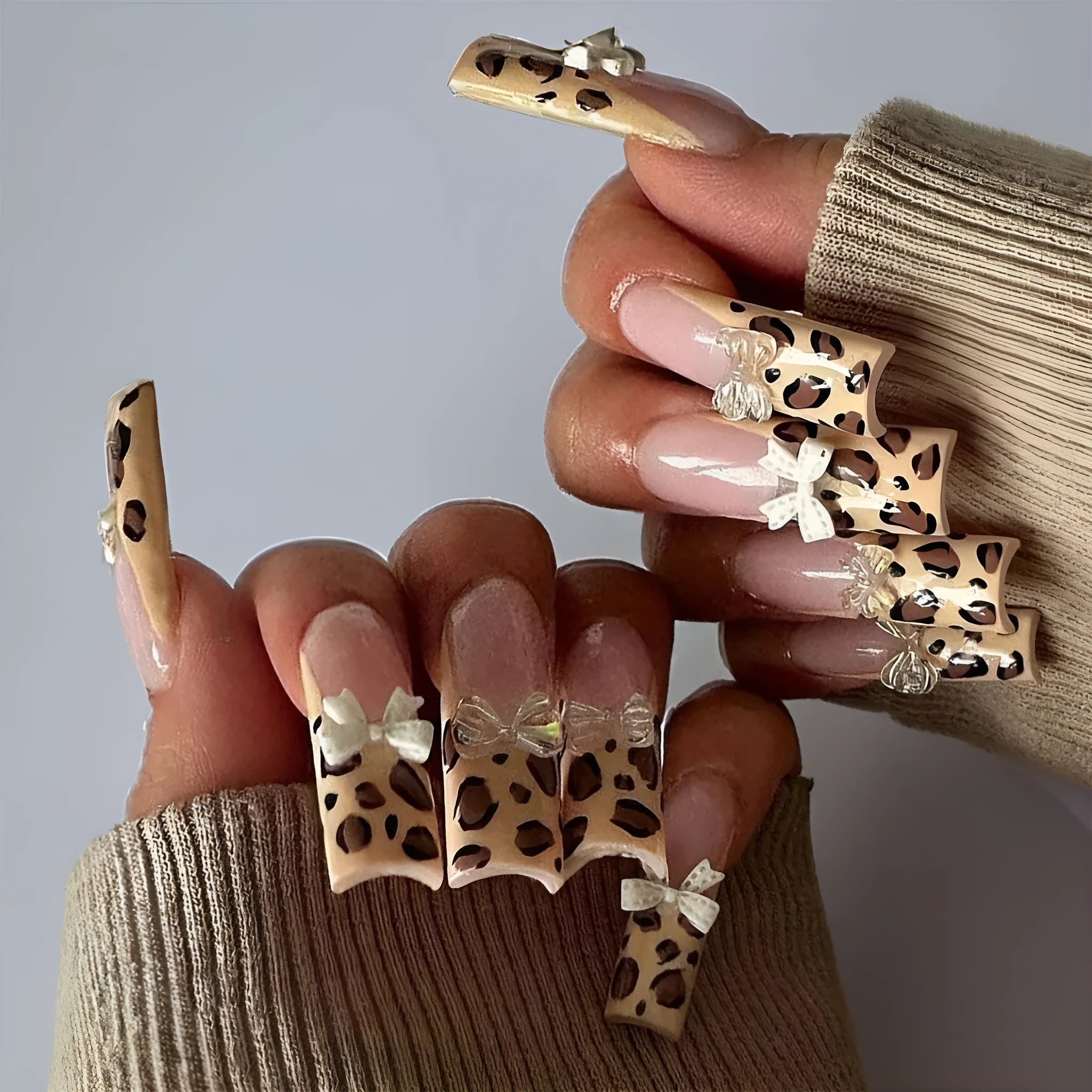 Leopard print false nails with butterfly designs in WM296 colour for women's manicure