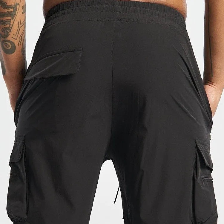 Men's black sports shorts with four-sided elastic fabric and quick-dry lining for running and gym workouts