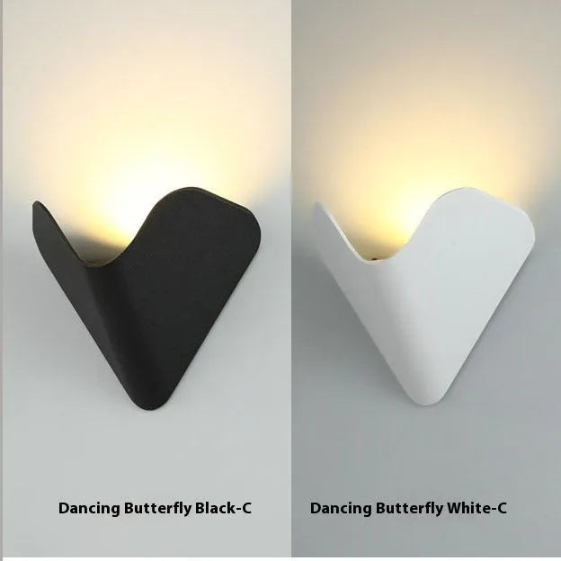 Black bird's nest design outdoor waterproof LED wall lamp with IP65 rating mounted on a wall.