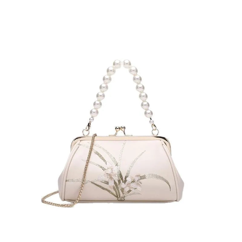 Beige women's shoulder bag with floral embroidery on soft PU leather material
