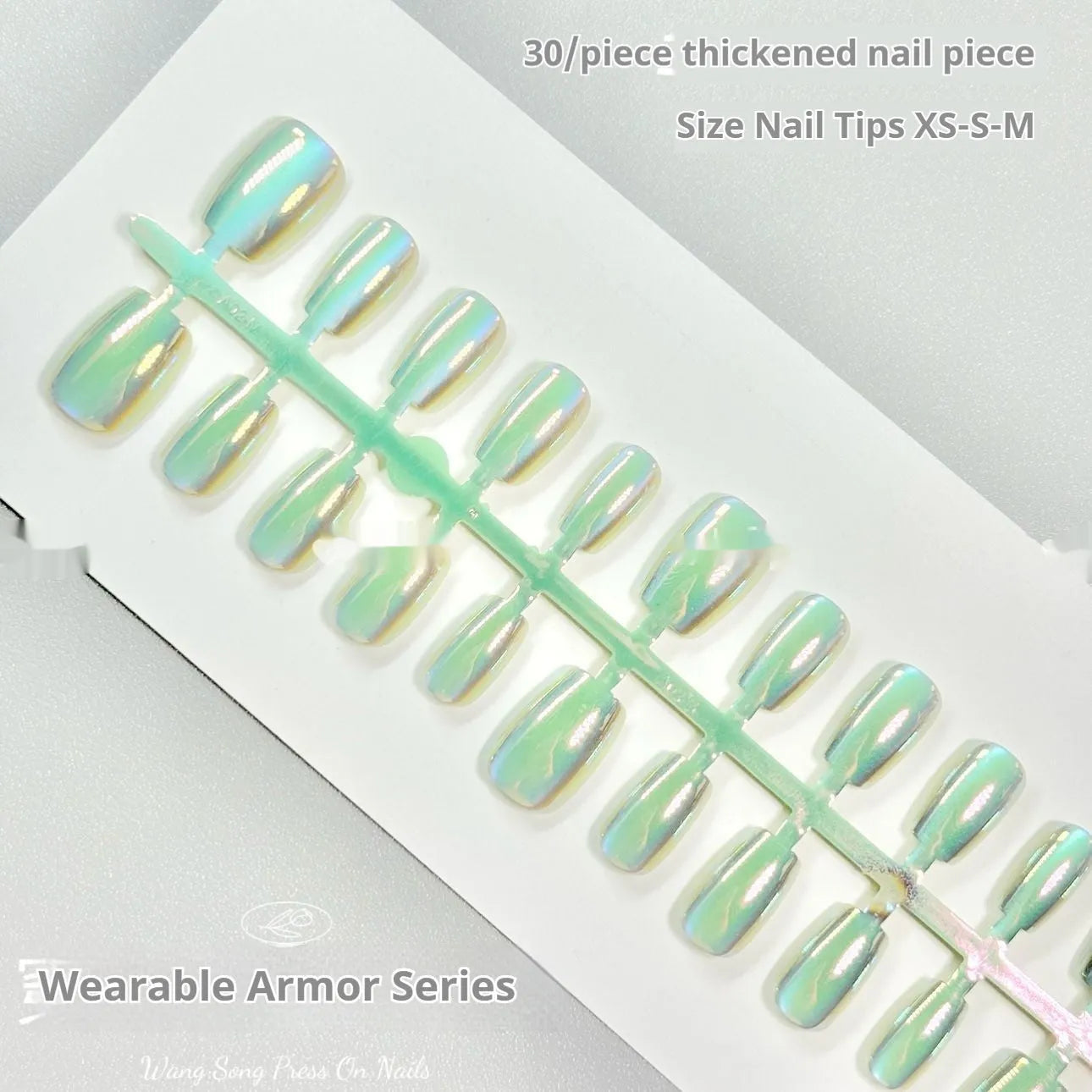 Set of electroplated Cat's Eye and Aurora effect press-on false nails in short ladder shape on a white background.