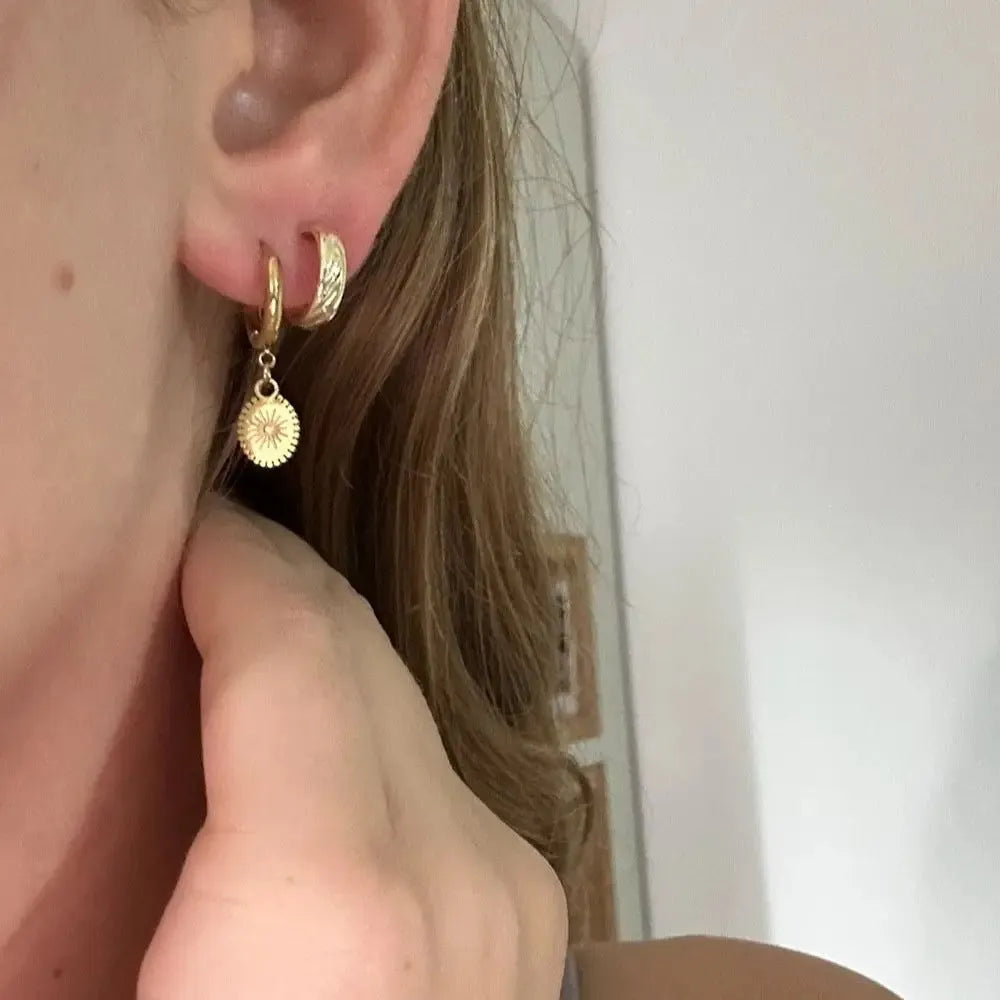 Stainless steel geometric ear button earrings with ellipse design in silver tone