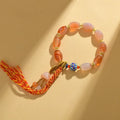 Jinsi jade agate Tibetan bracelet with geometric flower shapes and lily pattern in colour Z009