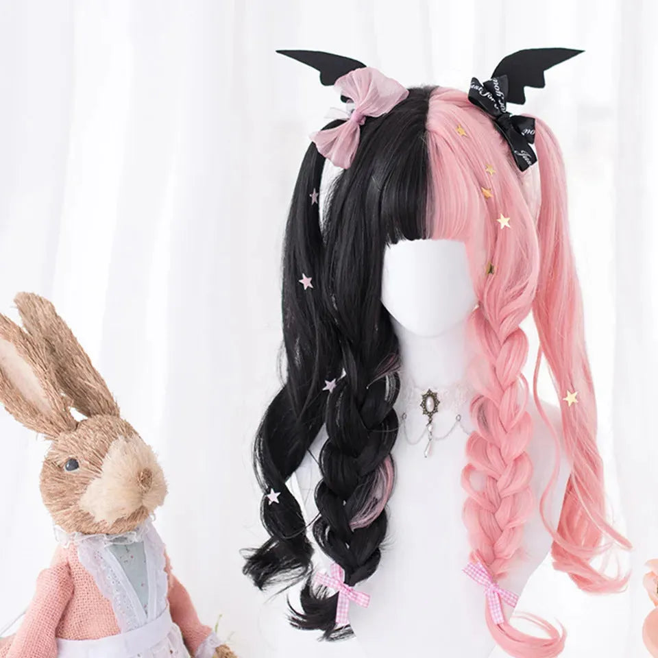 Harajuku Japanese Lolita style long curly black and pink wig with bangs on a wig stand.