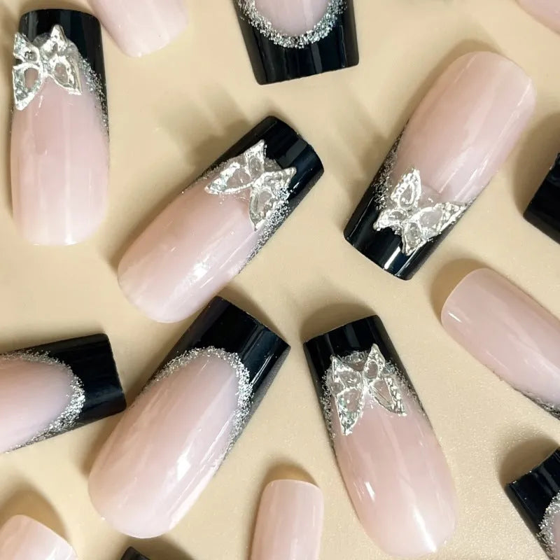 Black French-style glitter butterfly wear armour nail art set on a nail.