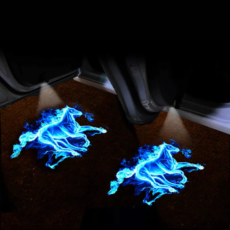 Black F2 USB rechargeable car welcome light projecting illuminated image on ground.