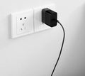 Black ZMI USB-C 65W notebook power adapter with compact design.