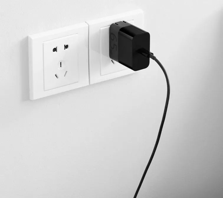 Black ZMI USB-C 65W notebook power adapter with compact design.