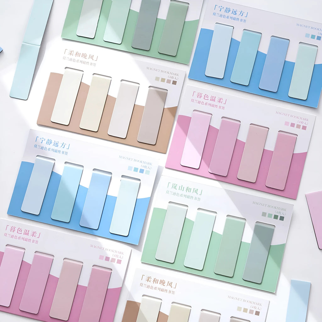 Set of four pastel colour block magnetic bookmarks from the Morandi series on a book page.