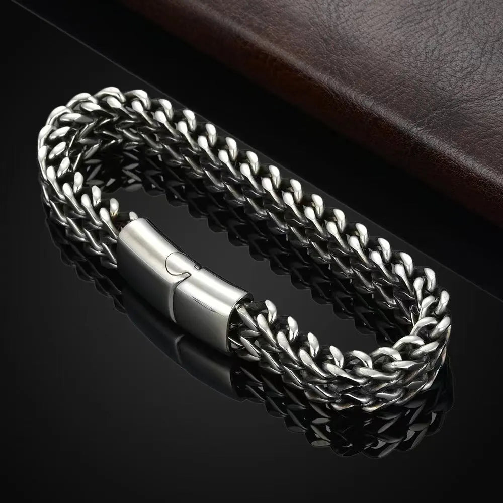 Silver stainless steel men's bracelet with geometric links, shown in 4x8mm and 5x10mm sizes on a wrist.