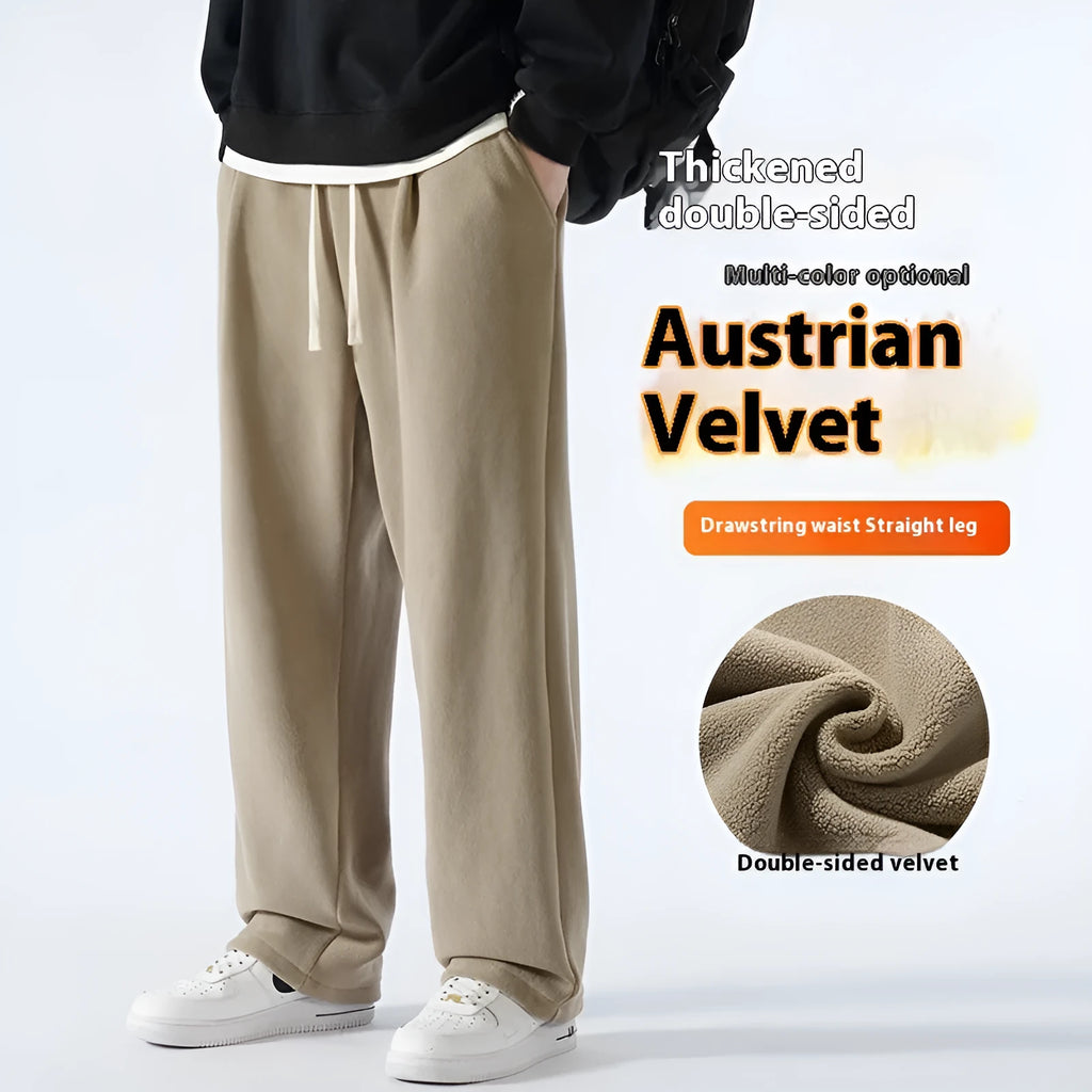 Man wearing apricot coloured double-sided polar fleece winter trousers with a loose fit and drawstring waist.