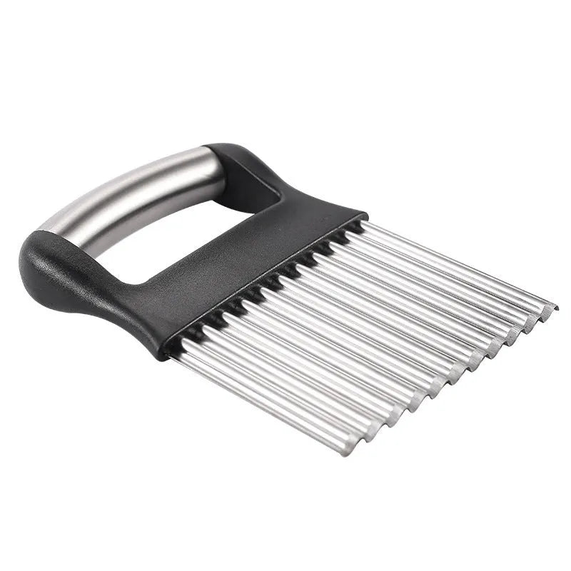 A black stainless steel potato wave knife on a kitchen counter, showing its corrugated blade.
