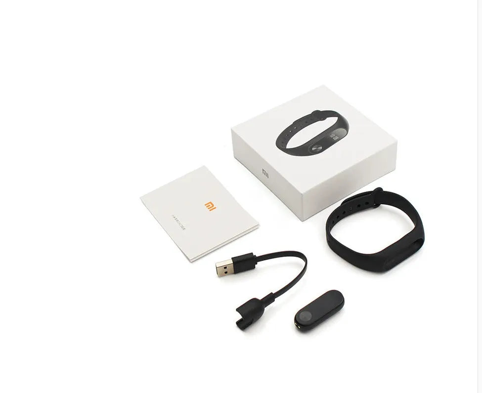 Xiaomi Mi Band 2 black smartband with OLED display on adjustable grey wrist strap.