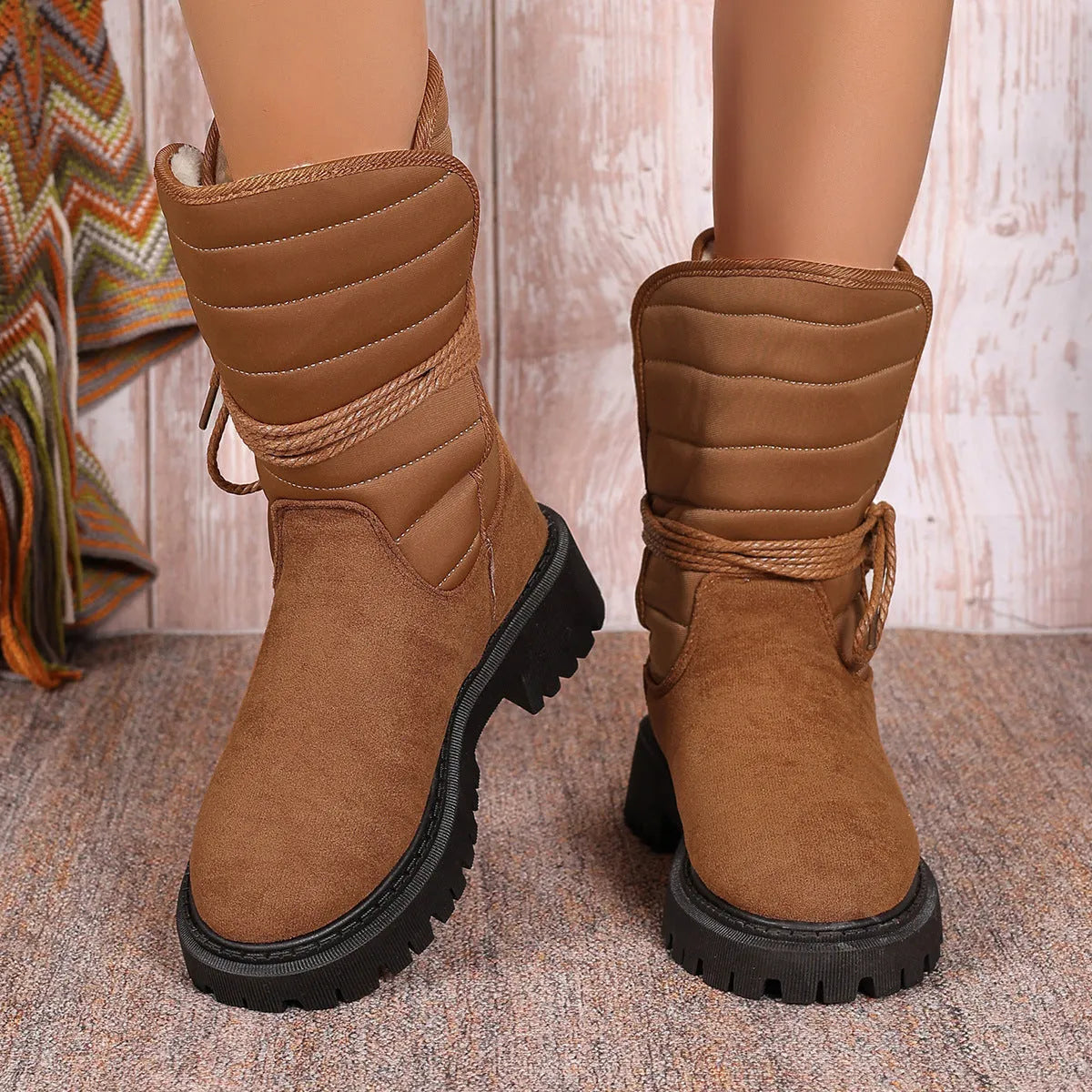 Women's black suede chunky heel mid-calf snow boot with lace-up front and fleece lining.