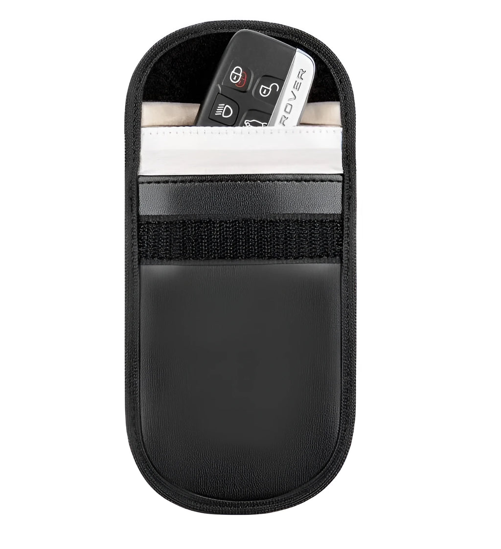Black microfiber Faraday pouch for blocking car key and credit card signals, shown with a key fob inside.