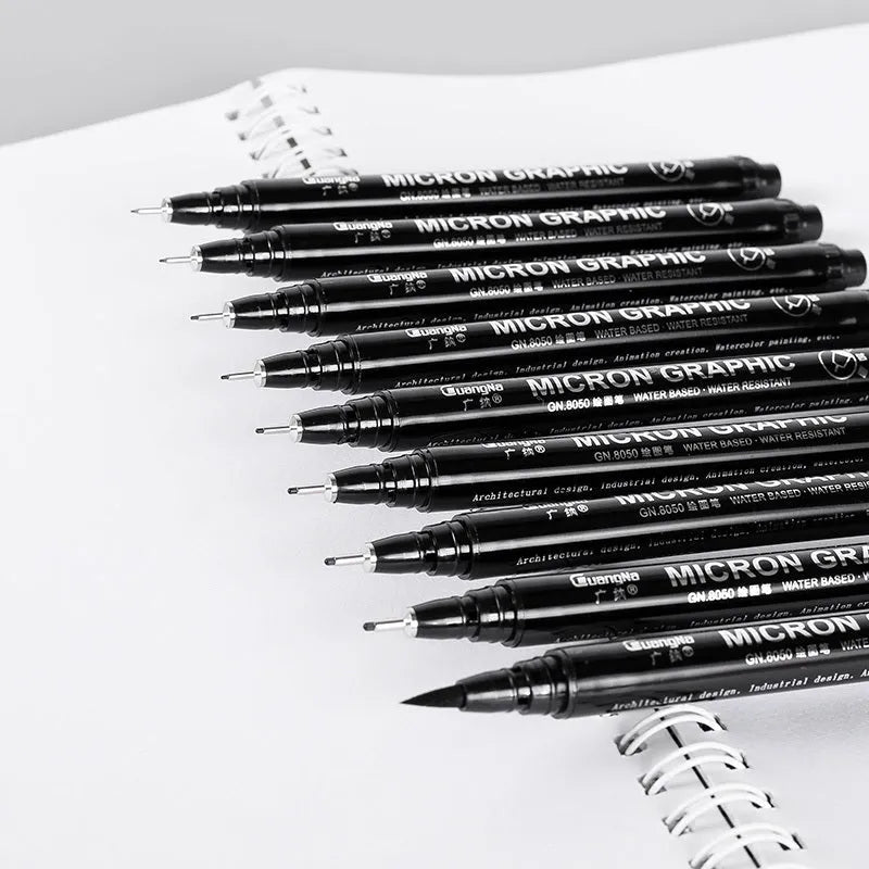 Set of 12 black comic hand-painted pens with various nib sizes in a storage bag organiser