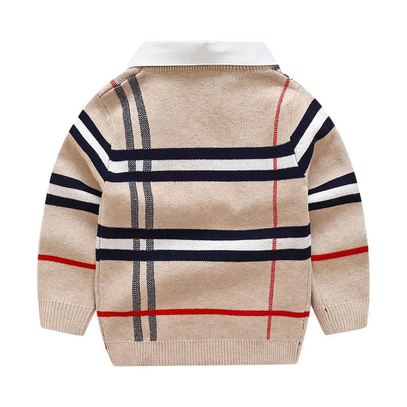 Boys apricot and navy blue plaid jacquard knit sweater with long sleeves on hanger.