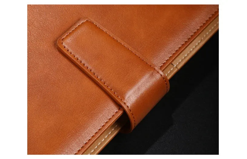 A5 hardcover PU binder notebook with metal buckle clip, shown in multiple colours.