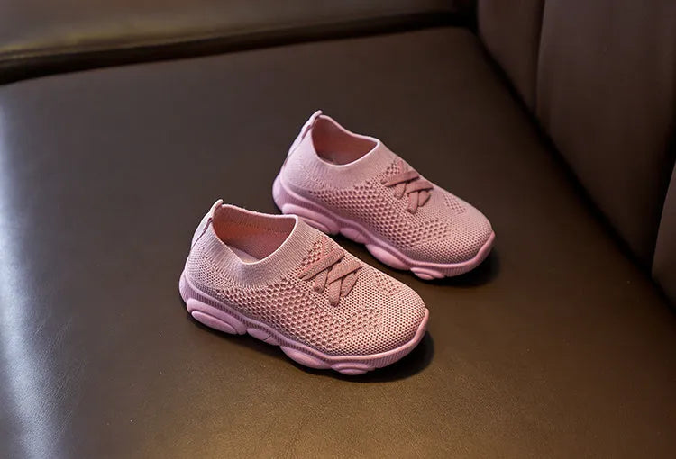 Children's fabric lazy shoes in white, black, pink, and grey colours with non-slip rubber sole