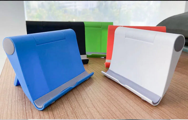 Black PE folding mobile phone stand holding a tablet at an angle on a desk