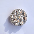 Rhinestone ring bracket phone holder for Apple and Android mobile phones on a desktop.
